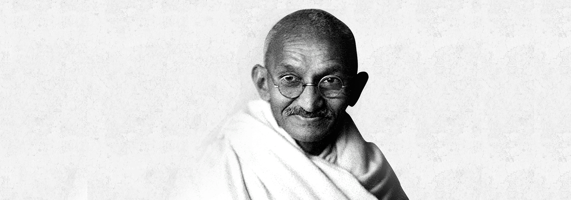 Gandhi at age 62 in England